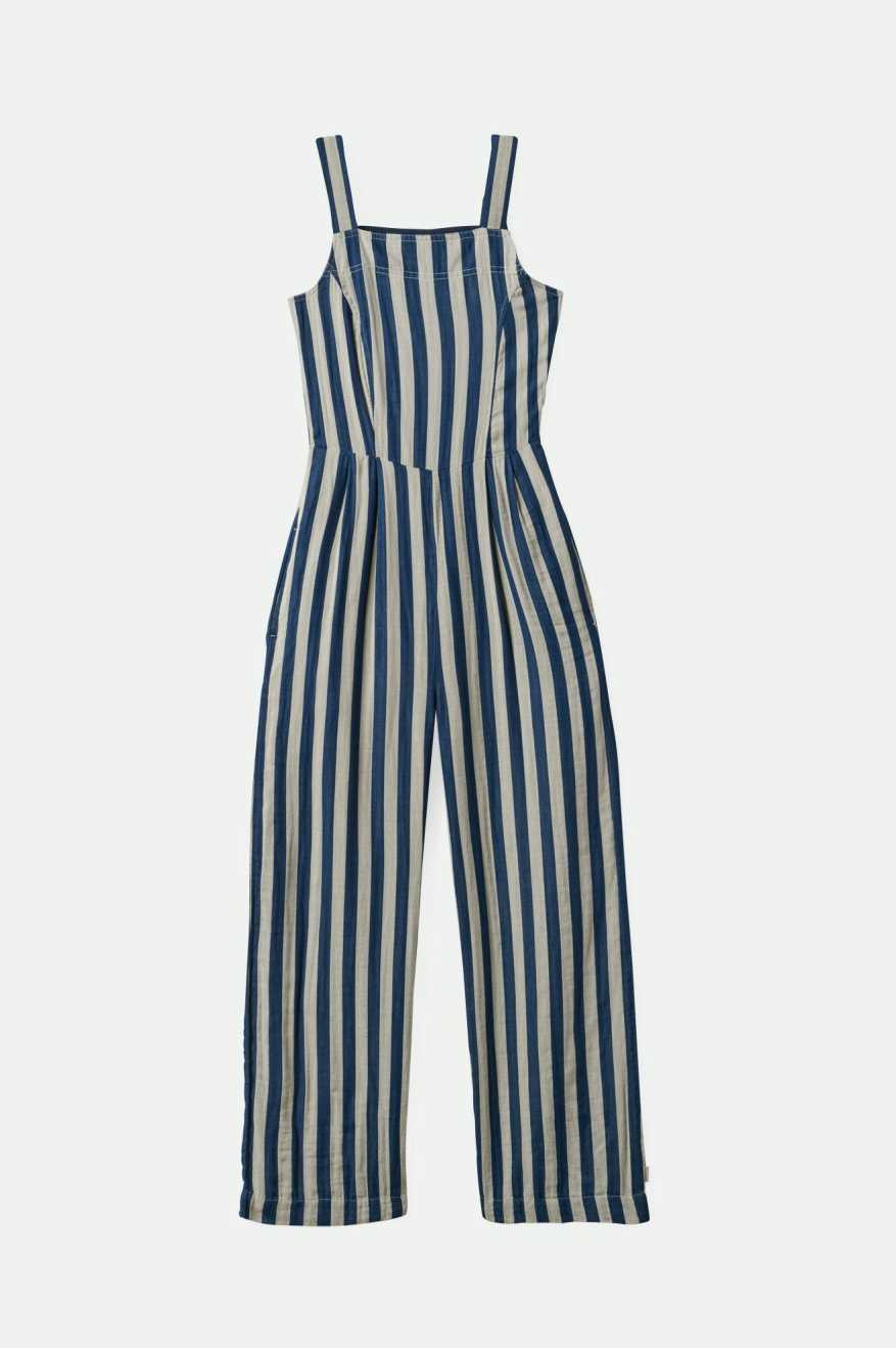 A sleeveless, striped jumpsuit in blue and white, with adjustable spaghetti straps and an elastic back.