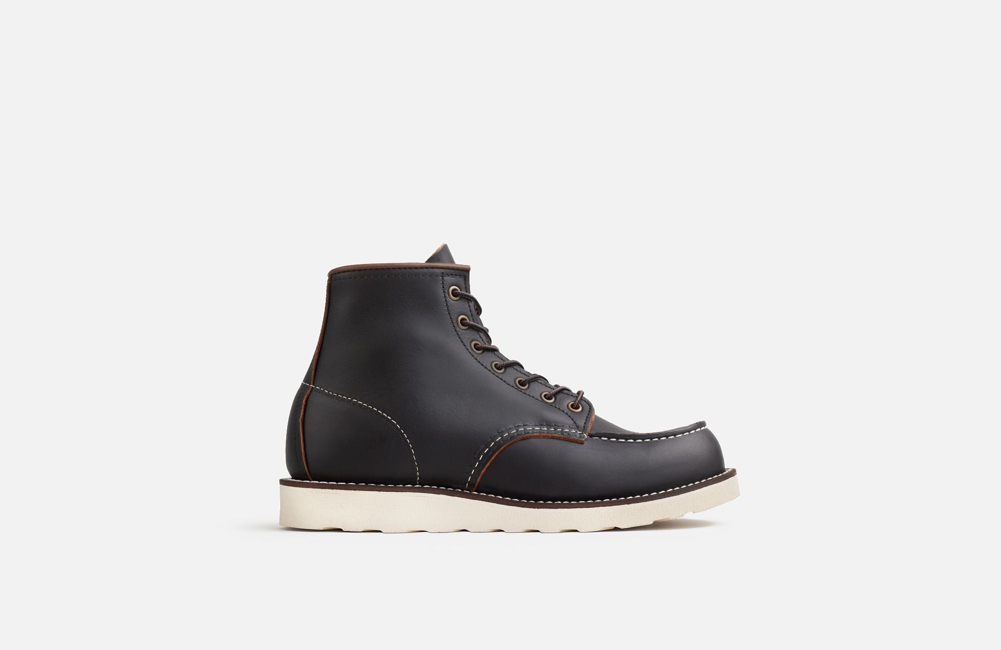 Side View of A Red Wing Men's 6 inch black moc toe boot on a white background.