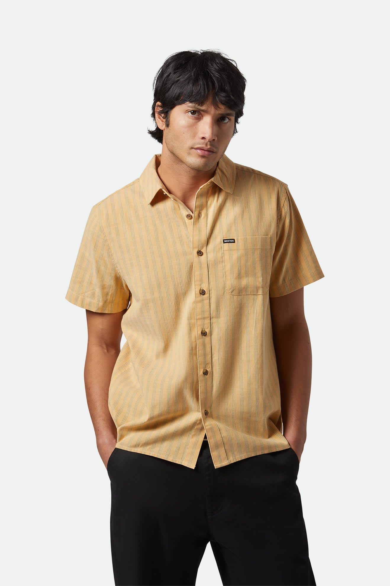Model Photo of Front of Brixton Men's Cru Oxford Strip Short Sleeve Shirt - Curry/ Ivy Green