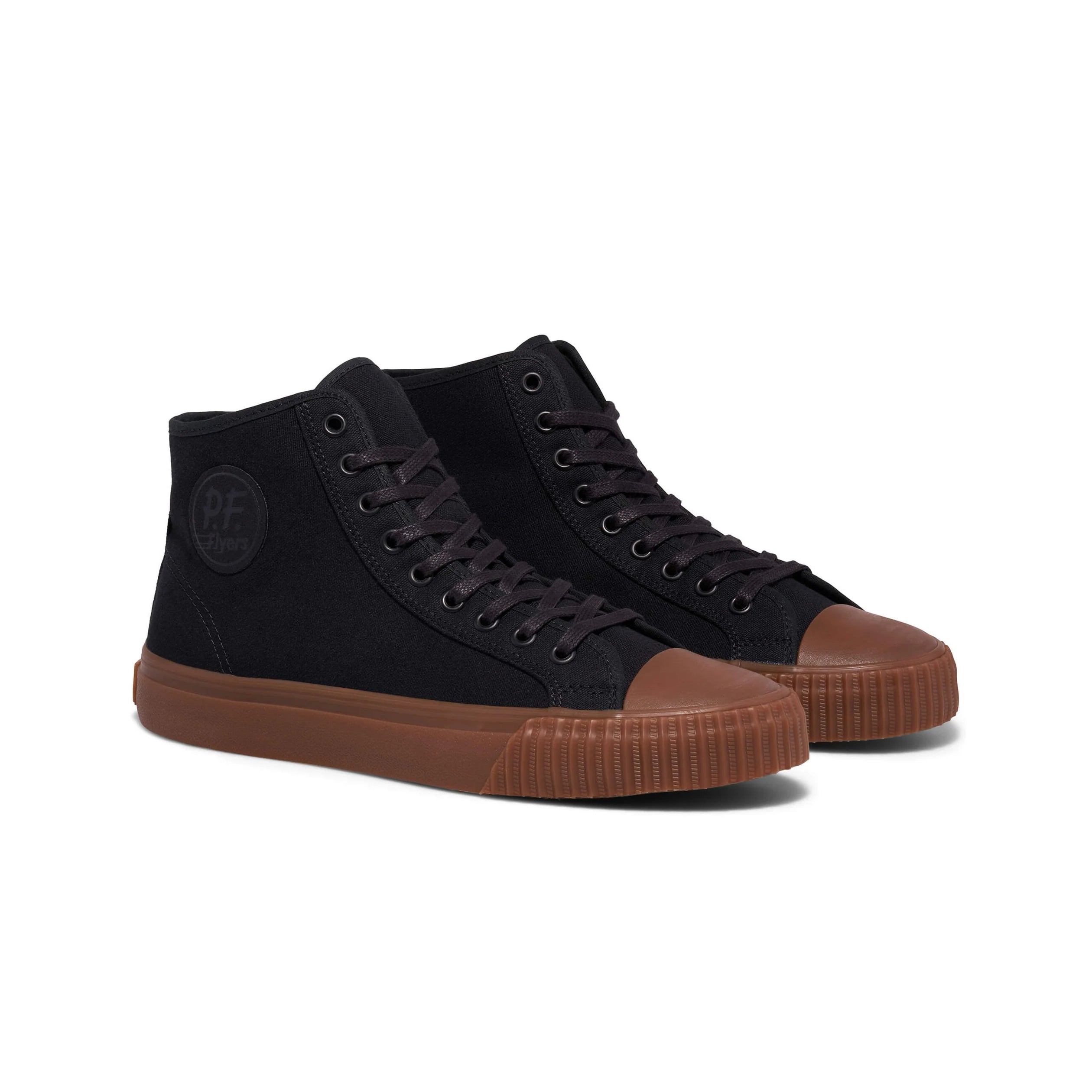 Black high-top sneakers with brown soles on a white background