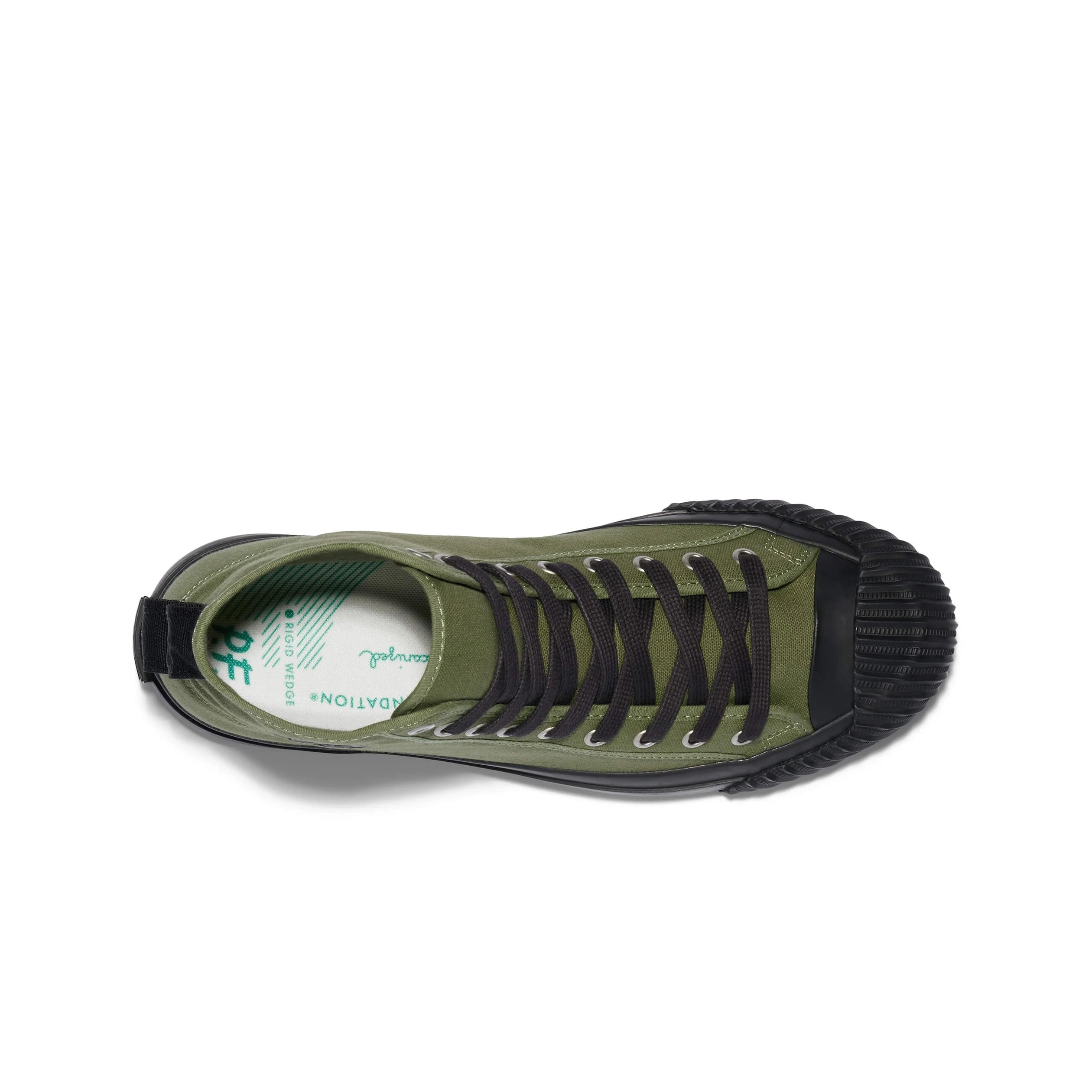Green sneaker with black sole on a white background