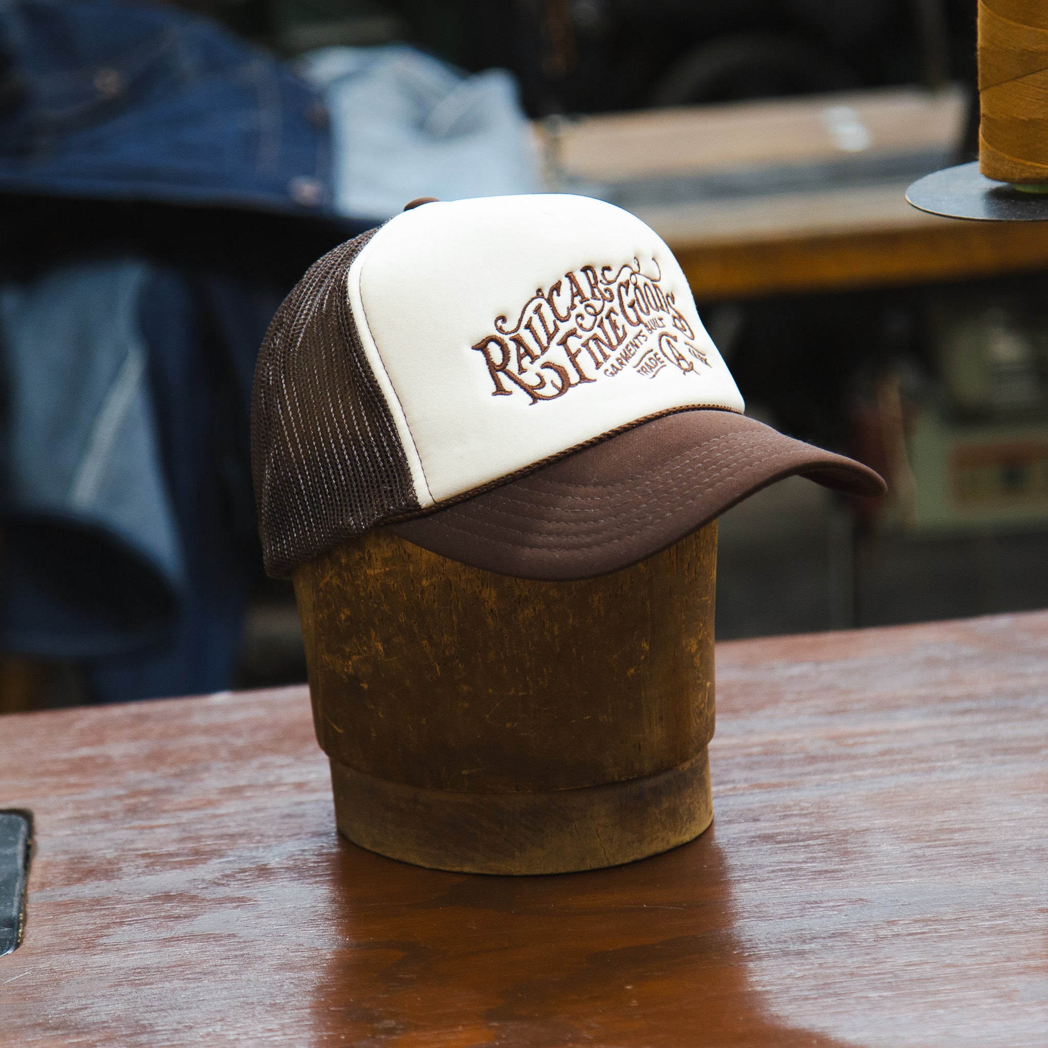 Front Angle of Railcar Typography Trucker Embroidered Tan Brown Hat