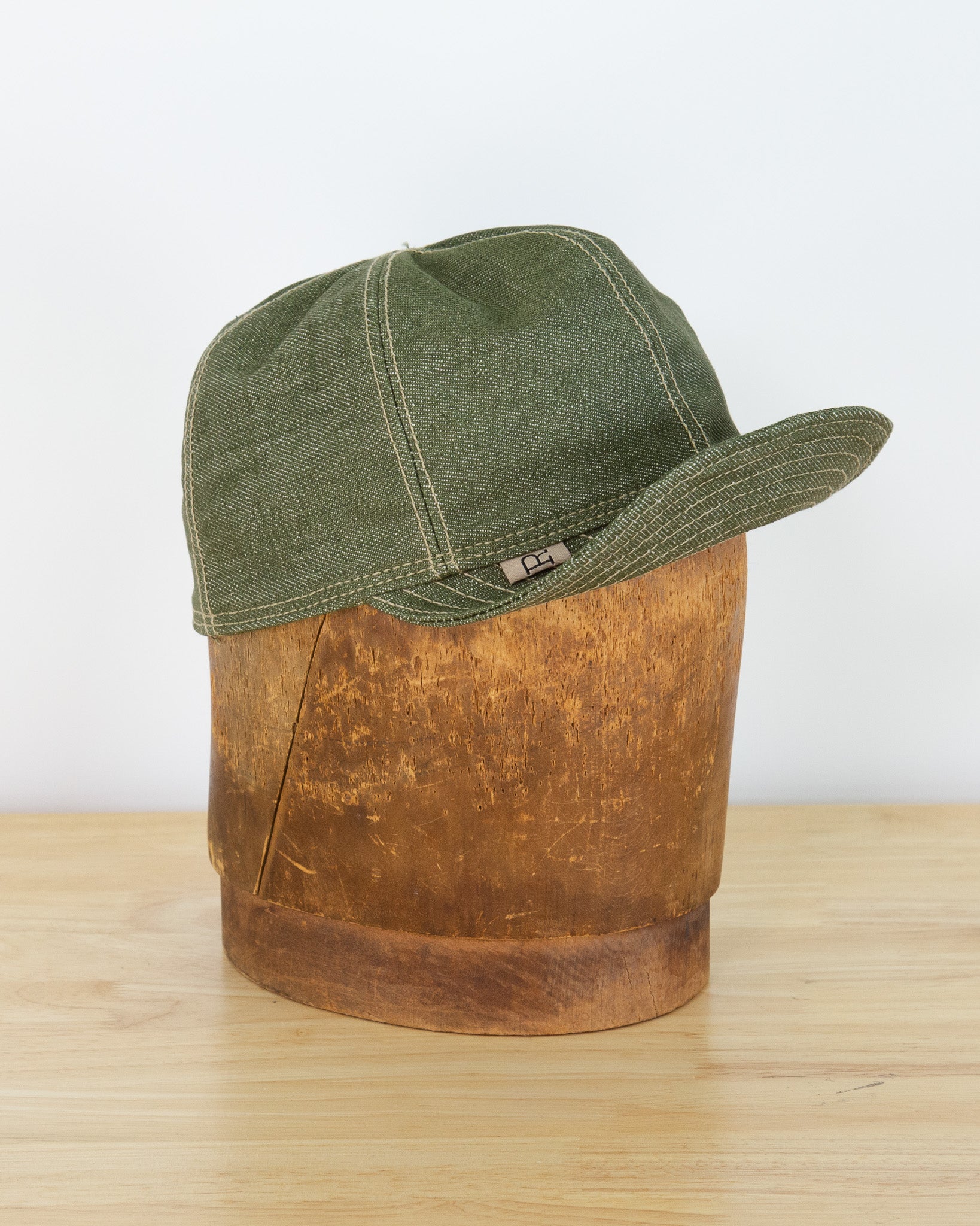 Front of X079 Pistachio Mechanic Hat with bill turned up
