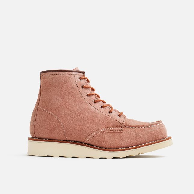 Side View of A pair of Red Wing women's boots in dusty rose color with lace-up closure and a moc toe style.