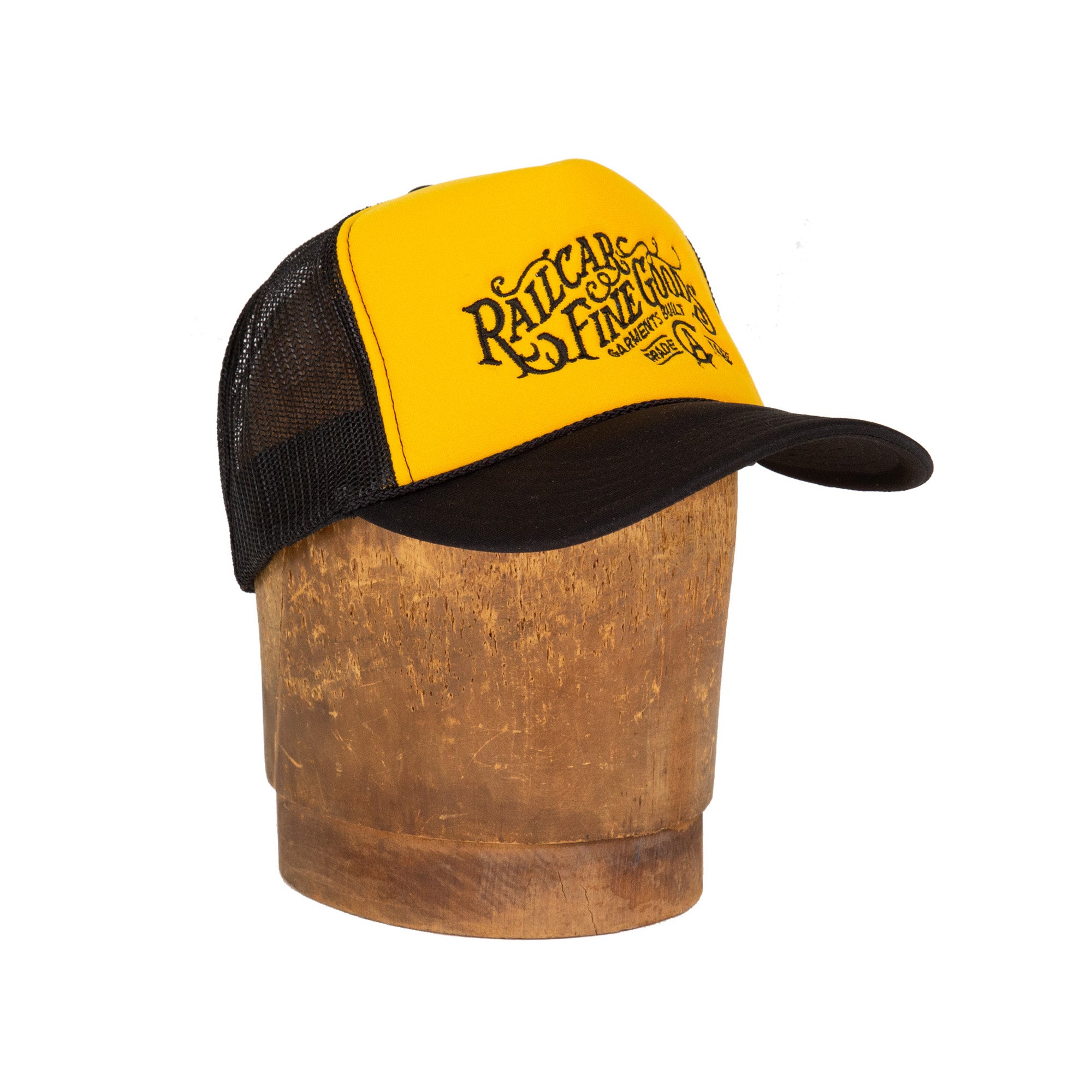 Front Angle of Railcar Typography Trucker Embroidered Yellow Black Hat