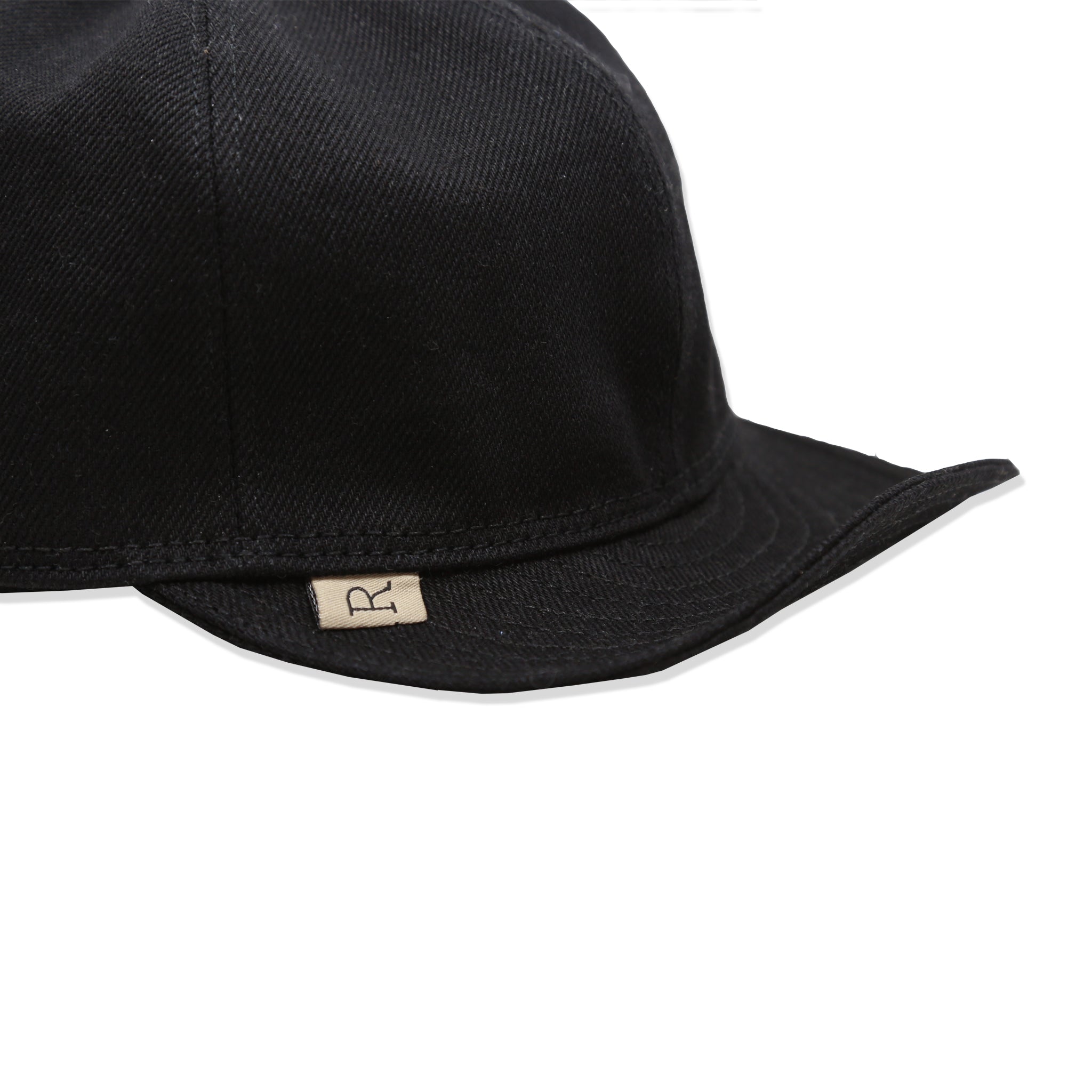 A black denim mechanic hat with a Railcar 'R tab" brand label sewn on the brim.