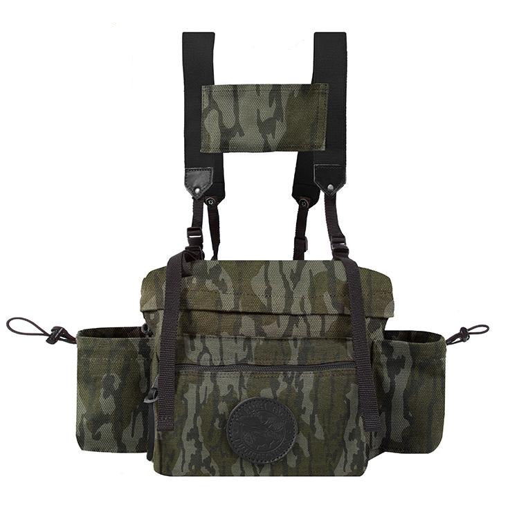 A camouflage Duluth Pack All Day Lumber Pack with visible straps and pockets, designed for carrying gear.