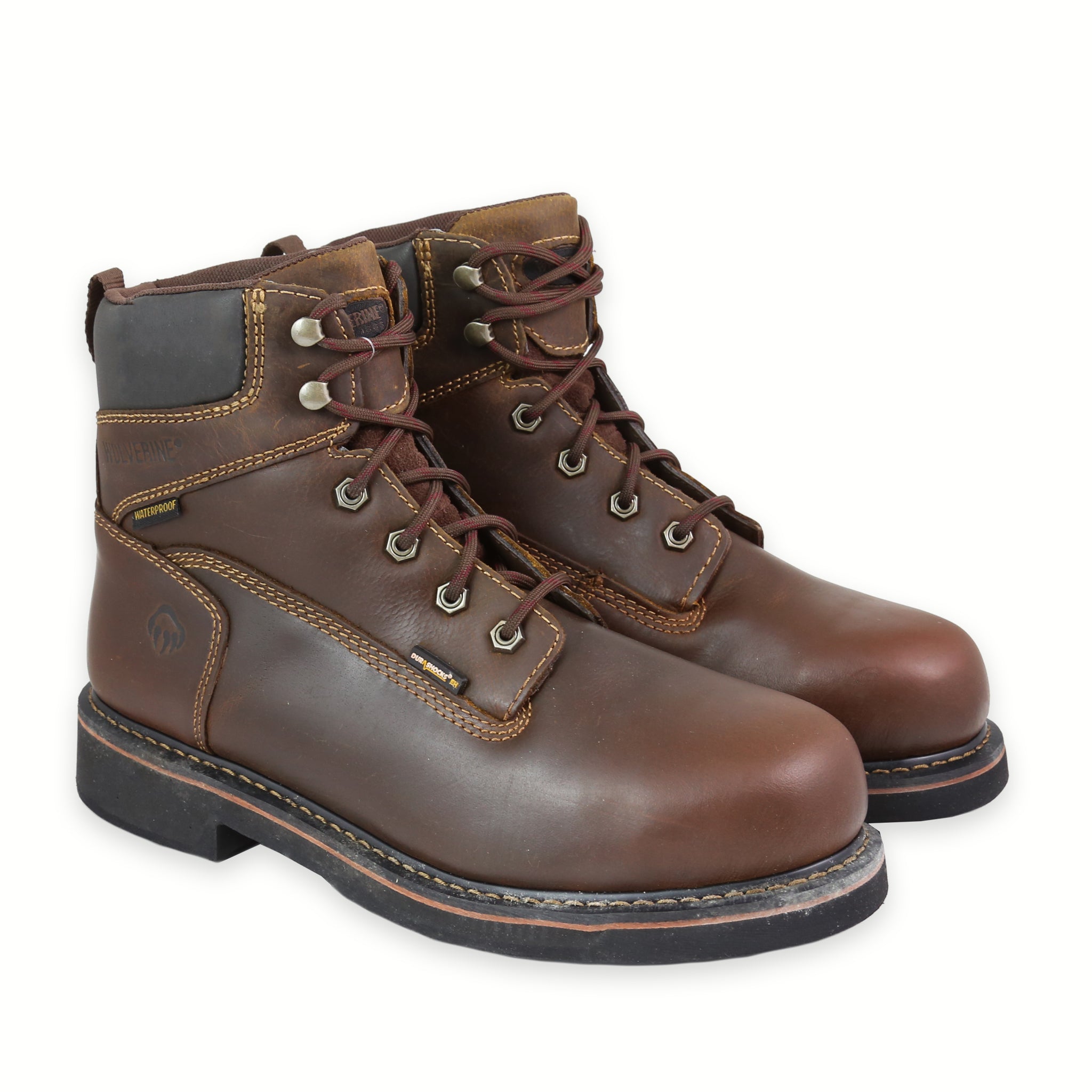 Front Angle of a brown Wolverine work steel toe boot with a rubber lug outsole and a visible brand logo on the side.