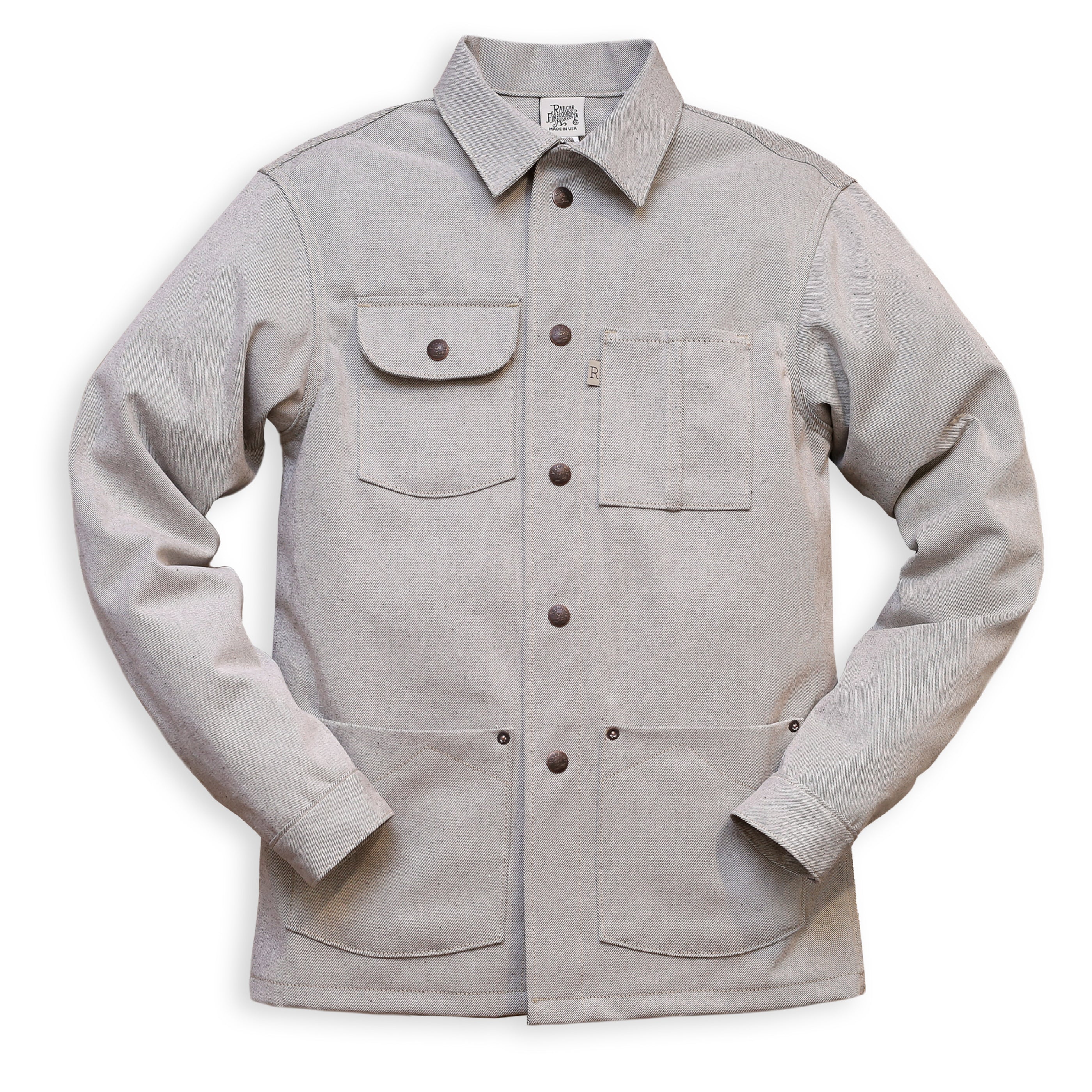 A gray Chore Coat with oatmeal denim fabric, featuring multiple pockets and branded snap buttons.