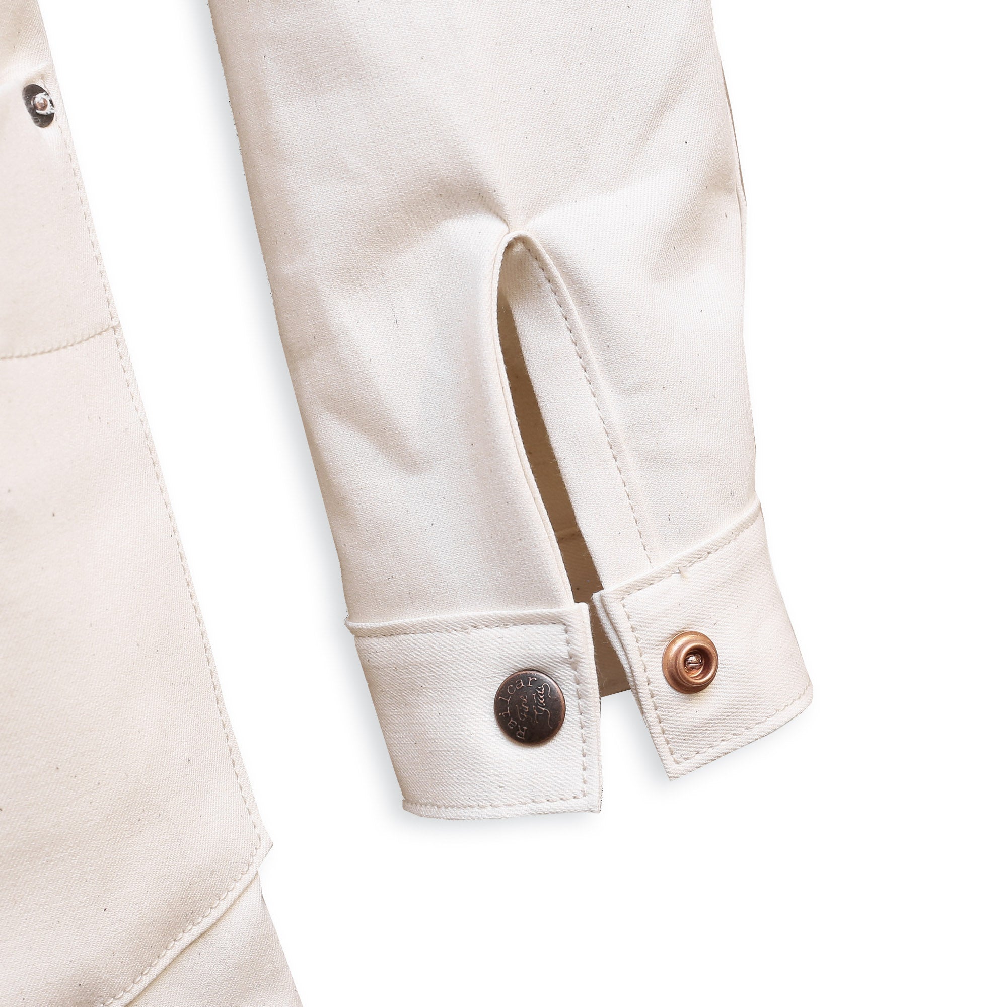 Cuff Detail of a natural seed chore coat with snap buttons