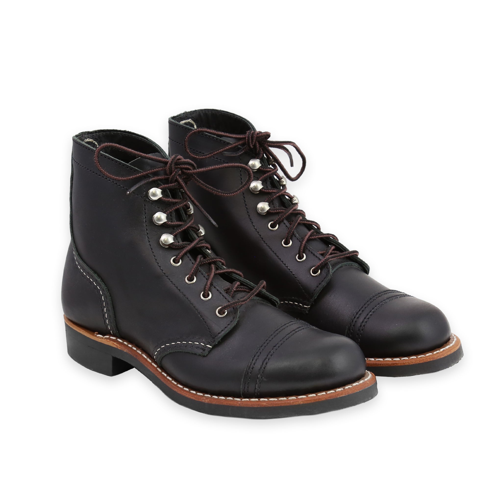 Front Angle of A pair of women's black iron ranger boots with lace-up closure and a Vibram sole.