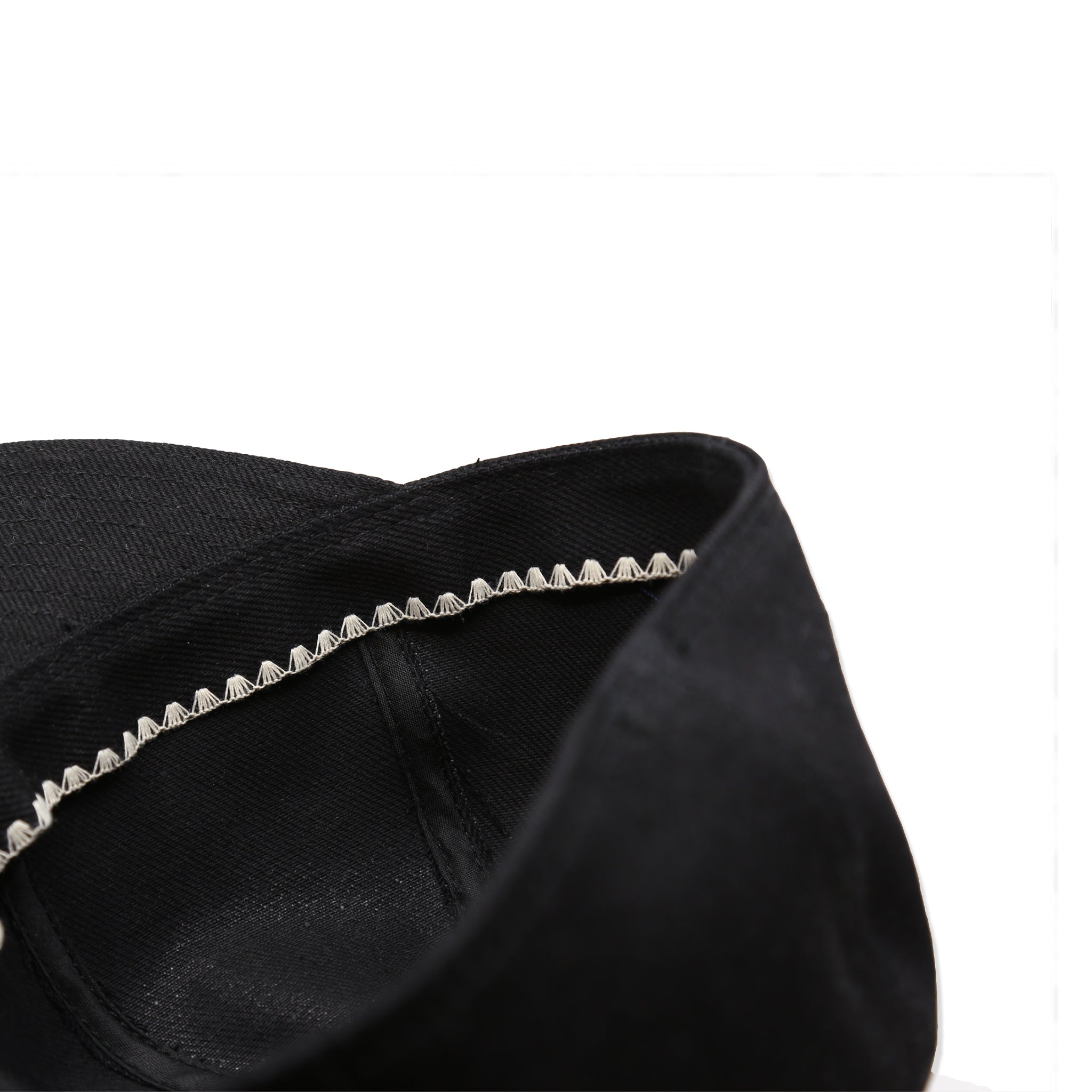 Interior Detail of A black denim mechanic hat 