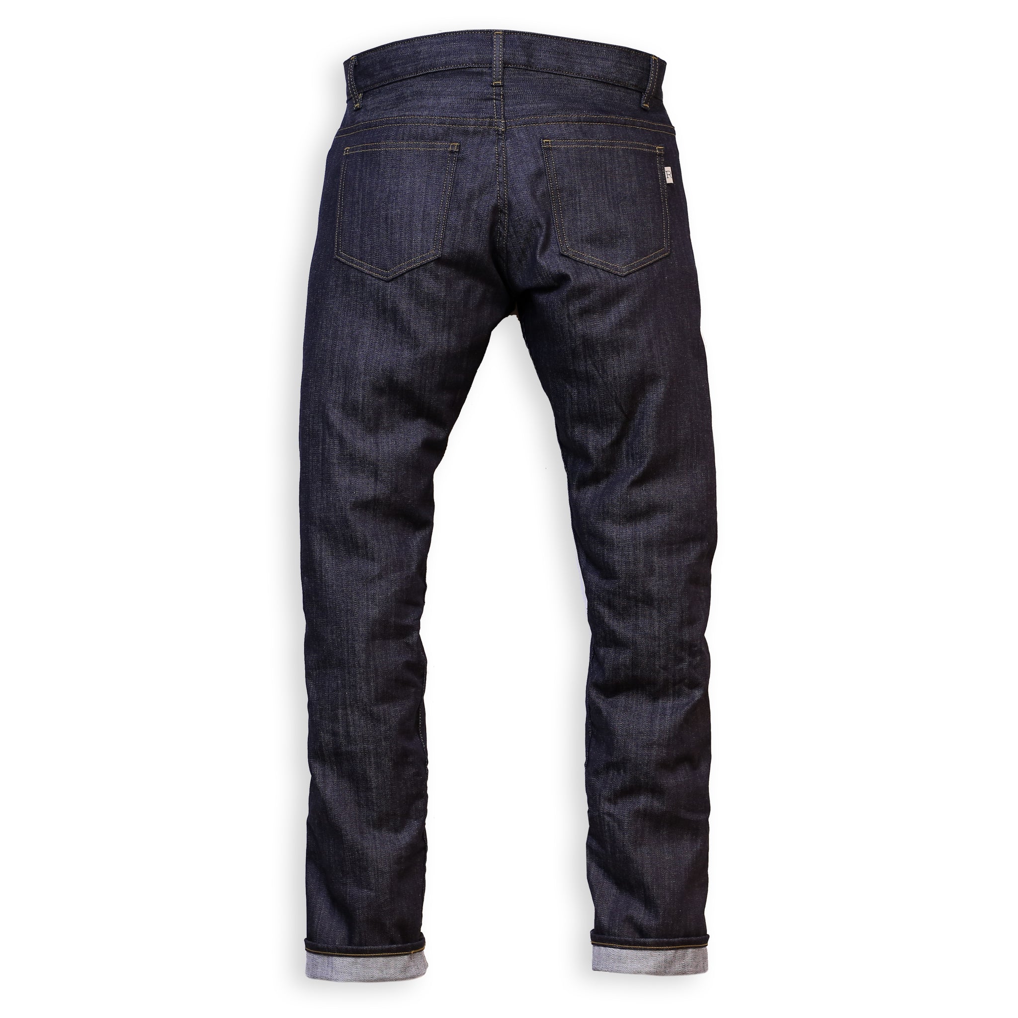 Back View of a pair of slim-fit blue denim jeans with a minimalist design, featuring a small 'R' logo on the back pocket.
